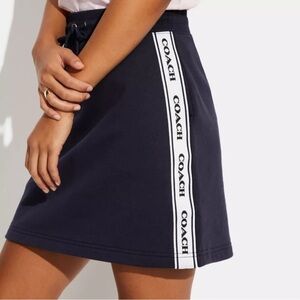 NWT COACH Navy Blue A-Line Mini Skirt Size M Sporty Logo Tape Detail Cotton